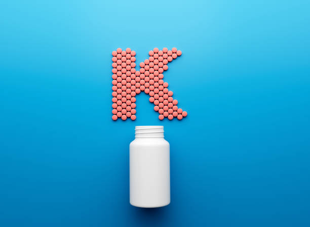 istock 3d Empty White Pill Bottle With K Text Made Of Rounded Vitamin K Tablets 3d Illustration 1738349145