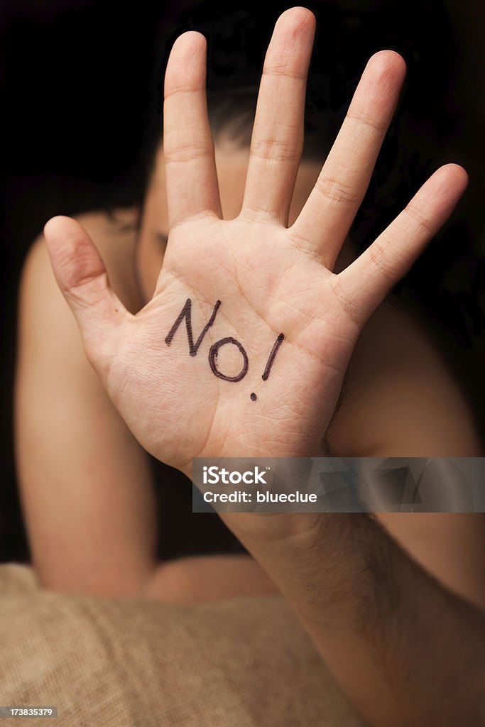 Rejection "Man with hand outstretched, with written text No! warding off any unwelcome situations.Selective focus, very shallow dof, wide angle, black background..Shot taken with 5D Mark II, 24-70 canon lens, xxl" Announcement Message Stock Photo