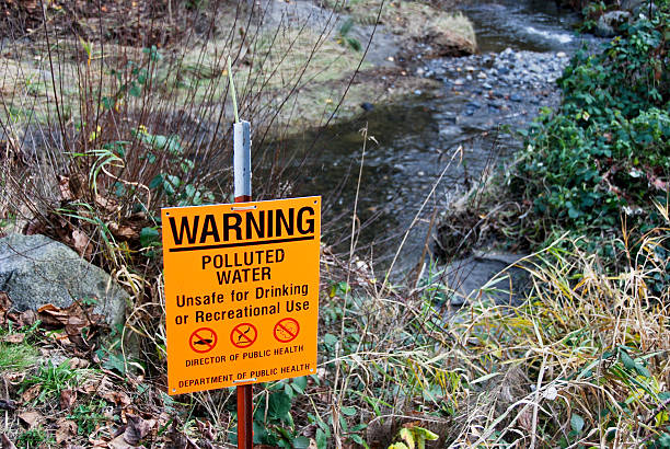 istock Polluted water sign at creek 173835531