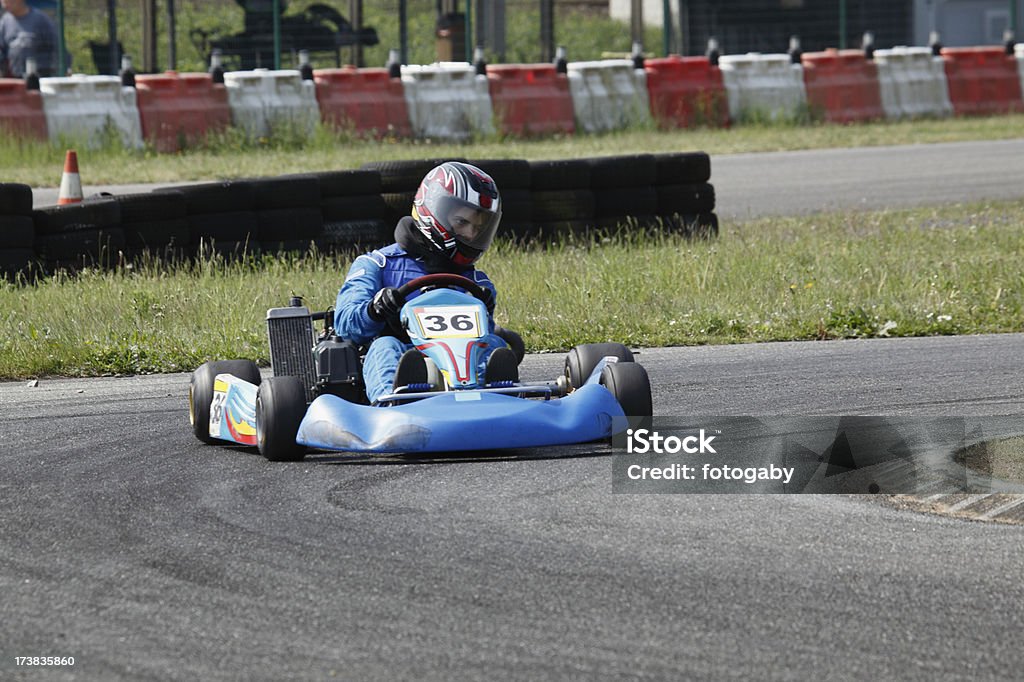 Kart in action Kartdriver with his kart by training.See my other go-kart racing photos Asphalt Stock Photo