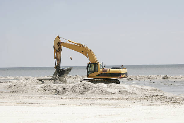 istock Bulldozer Rebuilds Sandy Beach after Katrina 173836249
