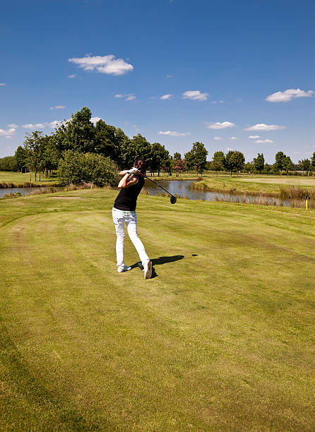 istock young female golf professional in the tee  box 173836423