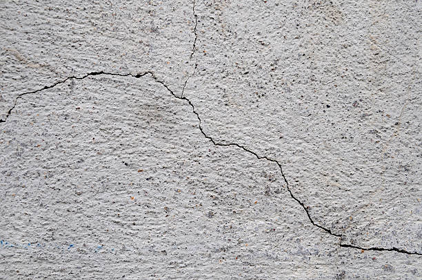 istock hairline crack in a wall 173836517