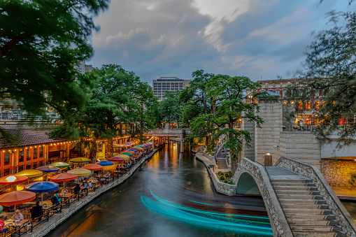 Long exposure light trails from boats along the Riverwalk in San Antonio, Texas USA