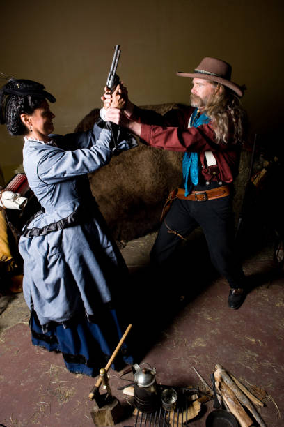 istock Couple Fight Over Gun Near Campfire 173837370