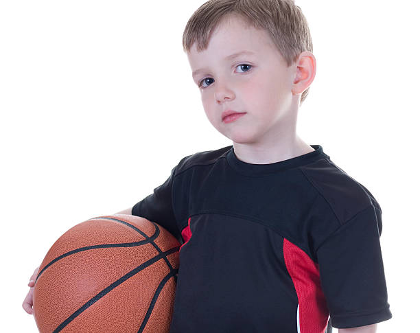 istock Boy holding basketball 173837642