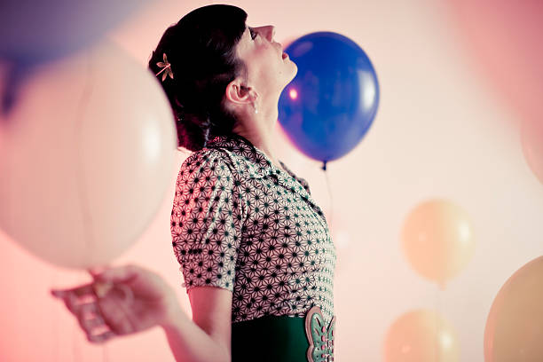 istock Woman with balloons 173838202