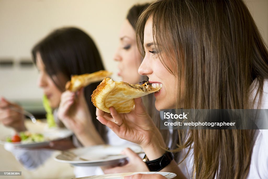 Eating pizza Eating pizza,canon 1Ds mark III Eating Stock Photo