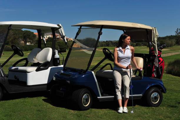 istock Young lady golfer waiting with her golf cart. 173838389