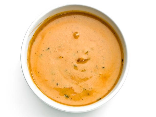 Gazpacho from above picture of a bowl of gazpach soup taken from above on white background  (this picture has been shot with a Hasselblad HD3 II 31 megapixels camera) bowl of soup stock pictures, royalty-free photos & images