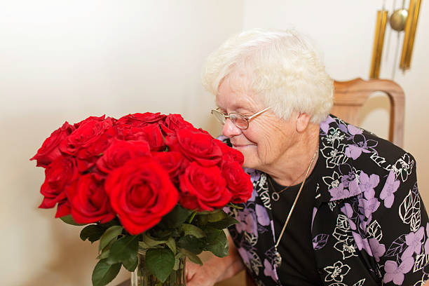 istock Senior Smelling flowers on mothers day 173838667