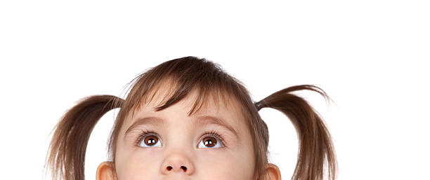 istock Young girl with brown pigtails looking up 173839210