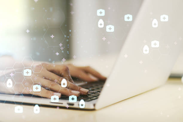 istock Creative abstract medical hologram and hands typing on computer keyboard on background, online medical consulting concept. Multiexposure 1738394560