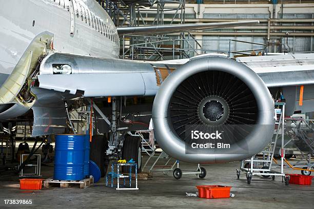Commercial Airplane Maintenance Check In Hangar Stock Photo - Download Image Now - Airplane, Repairing, Aerospace Industry