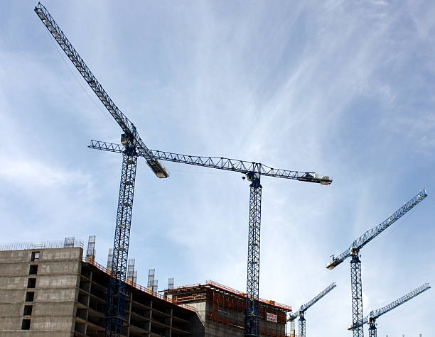 istock Large Construction Cranes On Top Of Building 173839956