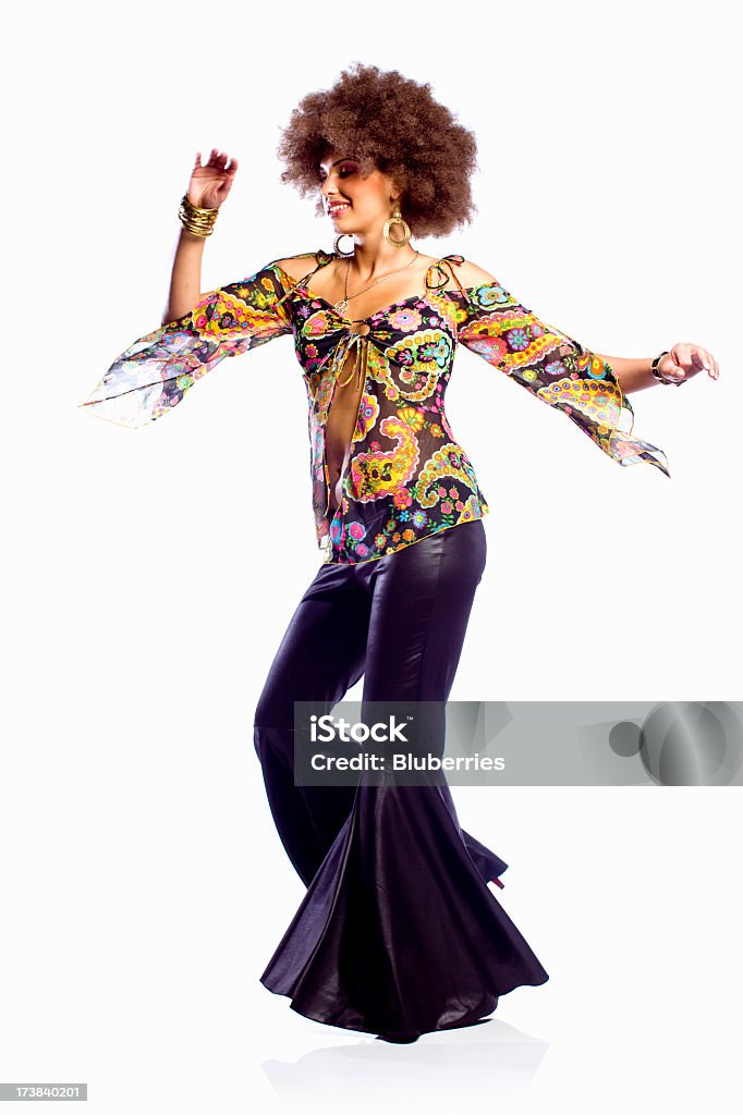 Disco Dancing Woman Dancing woman dressed in 70's styled clothing. 1970-1979 Stock Photo