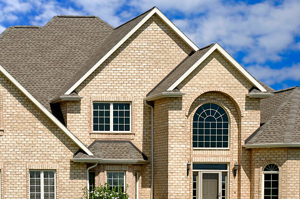 istock Luxurious New Beige Brick Home, Blue Sky, Half-Round Windows, Gables 173840702