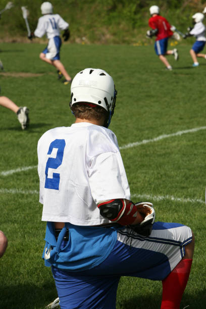 istock youth lacrosse player on the sideline 173841311