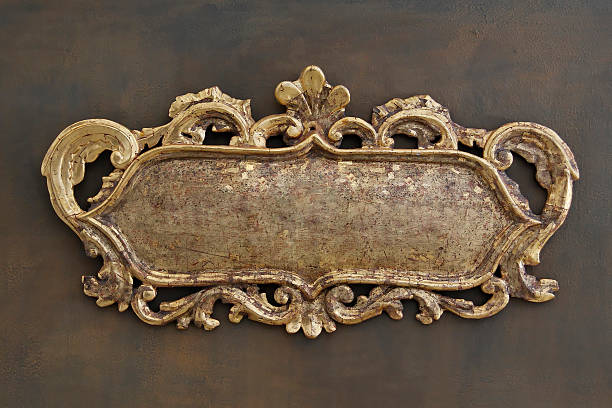 istock Ornate brass colored metal emblem on a brown wall 173841743