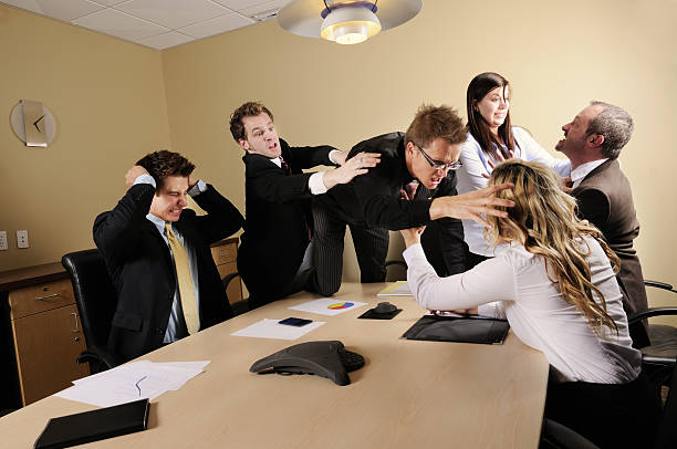 Business Conflict Business team fighting in the boardroom.  All graphs and charts are my own design. sabotage stock pictures, royalty-free photos & images