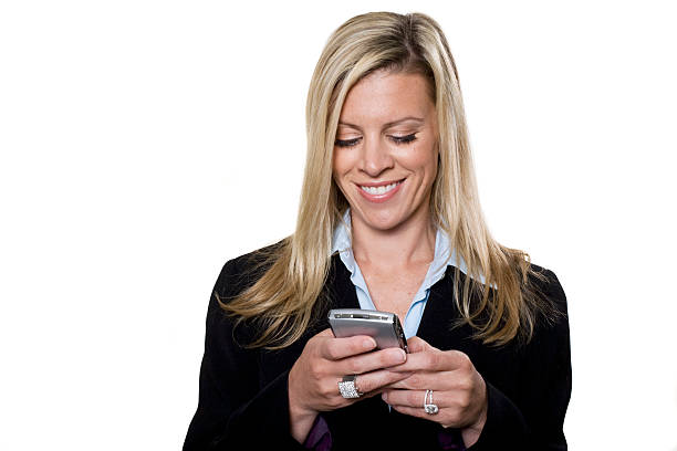 Attractive businesswomen working on her PDA stock photo