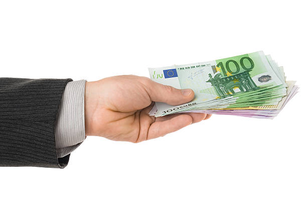istock Euro banknotes in hand isolated on white 173843204