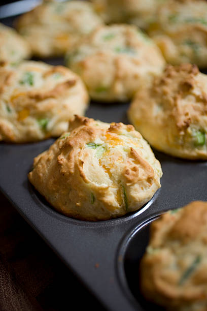 istock Close-up of cheddar cheese and ham muffins in pan 173843461