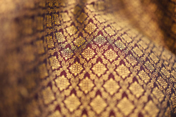 istock Backgrounds of Thailand style fabric pattern with golden 1738434855