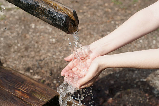 istock Fresh water pouring on womans hands 173843772
