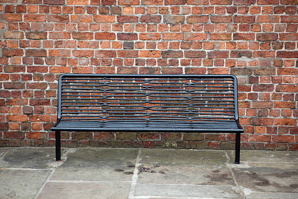 istock Metal bench and brick wall, Kings Parade, Liverpool, UK 173844218