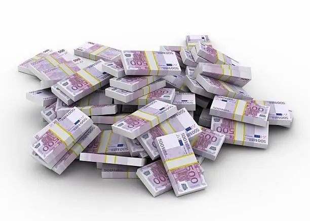 Huge pile of 500 Euro bill stacks isolated on white background