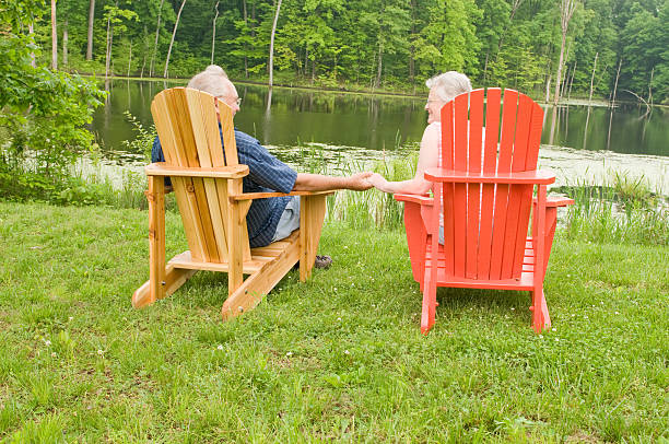 istock Happy Couple Relaxing at the Lake 173845417