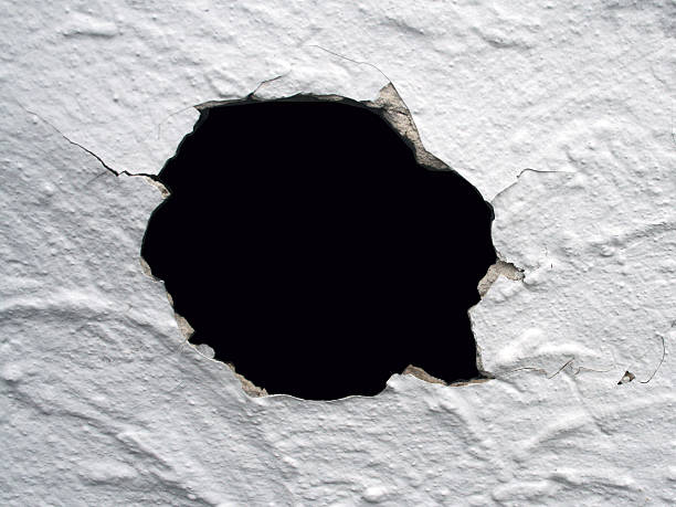 Hole in the wall stock photo