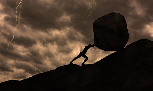 Strong man Pushing uphill Big Concrete Stone At rainy Cloudy Sky Thunder Storm . Businessman Push The Heavy Boulder up To The top of Mountain. Sisyphus , Hard Work and Don't give Up Conceit