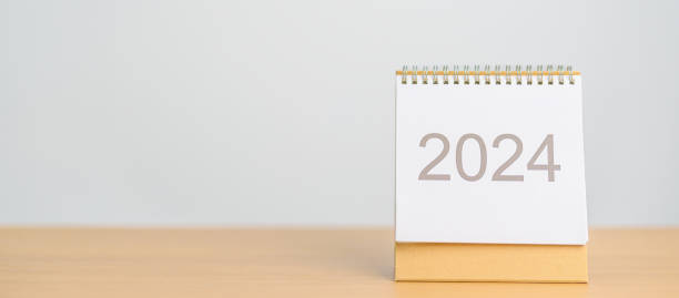 istock 2024 Year Calendar on table background. Happy New Year, Resolution, Goals, Plan,  Action, Mission and financial Concept 1738474831