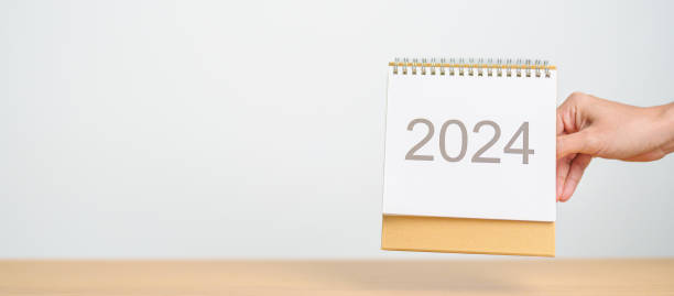 istock 2024 Year Calendar on table background. Happy New Year, Resolution, Goals, Plan,  Action, Mission and financial Concept 1738474832