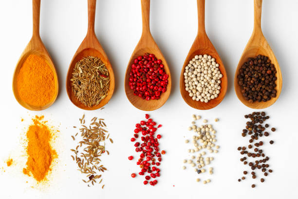 istock Wooden spoons with various spices isolated on white background 1738481807