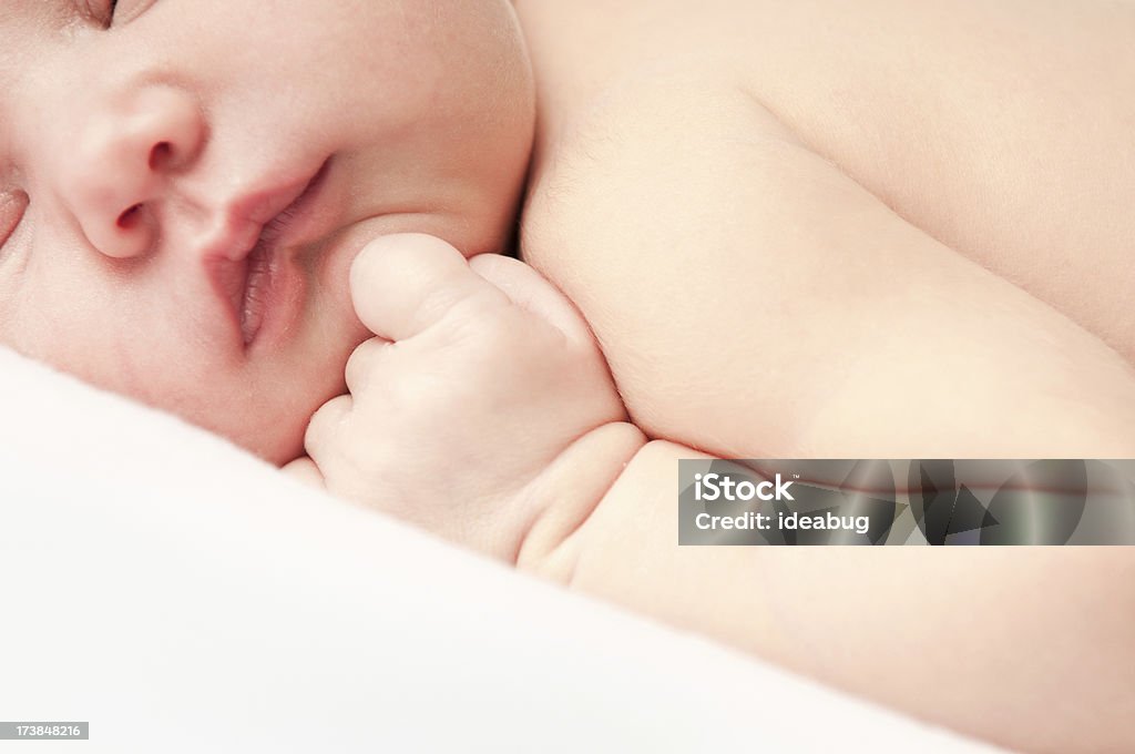 Newborn Baby Closeup Closeup color photo of a beautiful newborn baby sleeping peacefully. Baby - Human Age Stock Photo