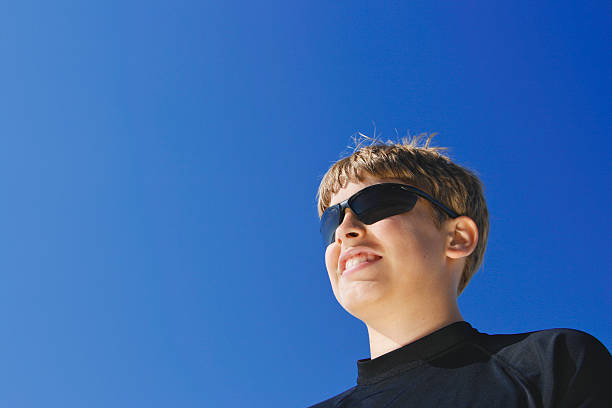 istock Sunglasses on Blonde Boy at Beach 173848368