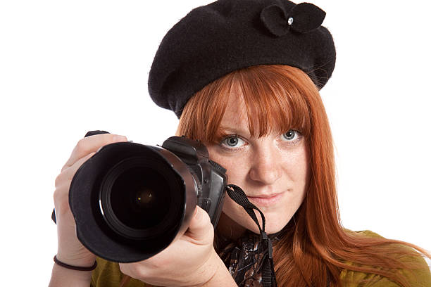 istock Female Photographer with Digital SLR Camera Isolated on White Background 173848446
