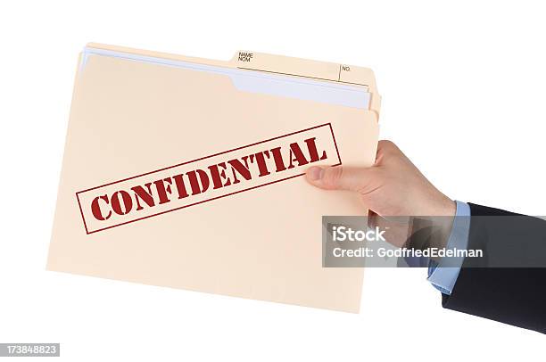 Foto de Informações Confidenciais e mais fotos de stock de Confidential - Palavra inglesa - Confidential - Palavra inglesa, Ficha - Documento, Mão humana