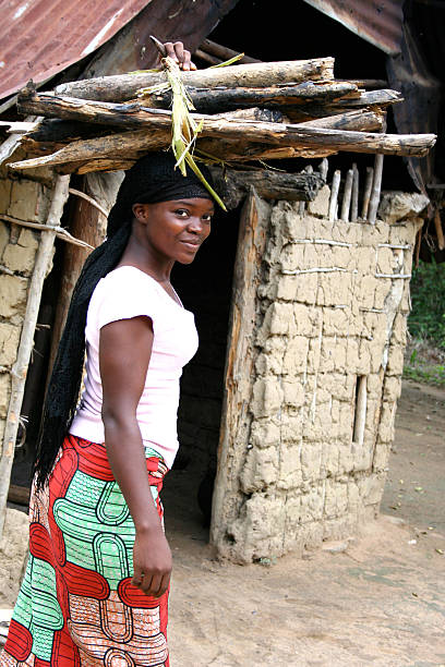 istock African Woman with Wood on Her Head 173849191