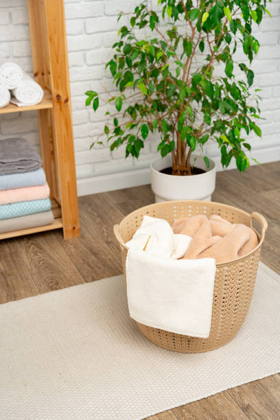 istock Beige plastic basket for laundry in a room 1738491933