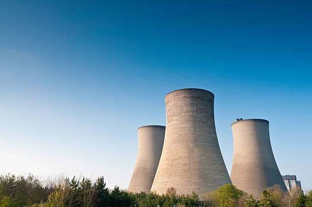 istock Power station cooling towers blue sky space 173849341