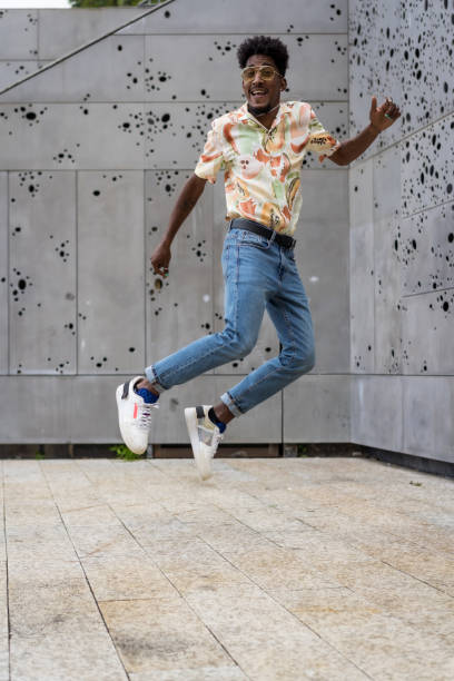 istock Model jumping happily on an urban square 1738494588