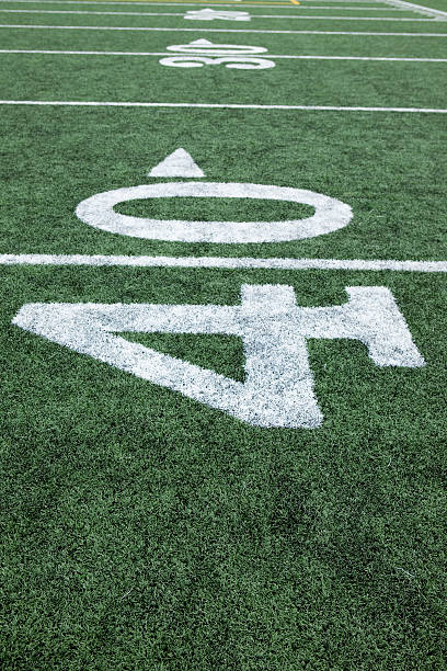 istock Football stadium 40 yard line artificial grass and markings 173849527