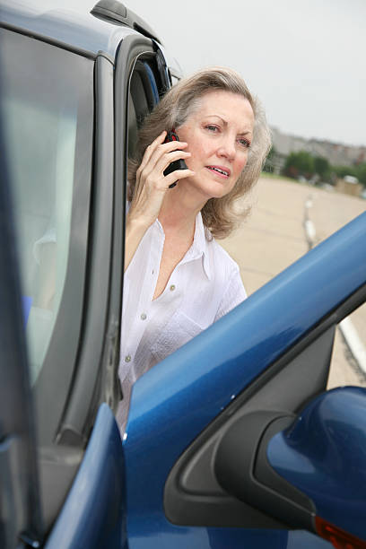 istock Woman Using Her Cell Phone While Sitting In A Car 173850114