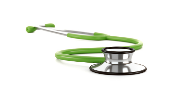 Green stethescope on white background, healtcare concepts.