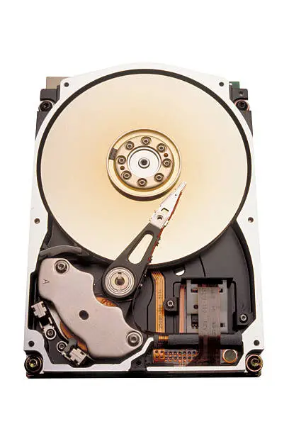 "Exposed view of a computer hard drive with case cover removed.The interior view shows the platter, spindle and actuator."
