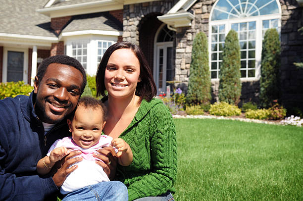 istock Young Family with New Home 173850360